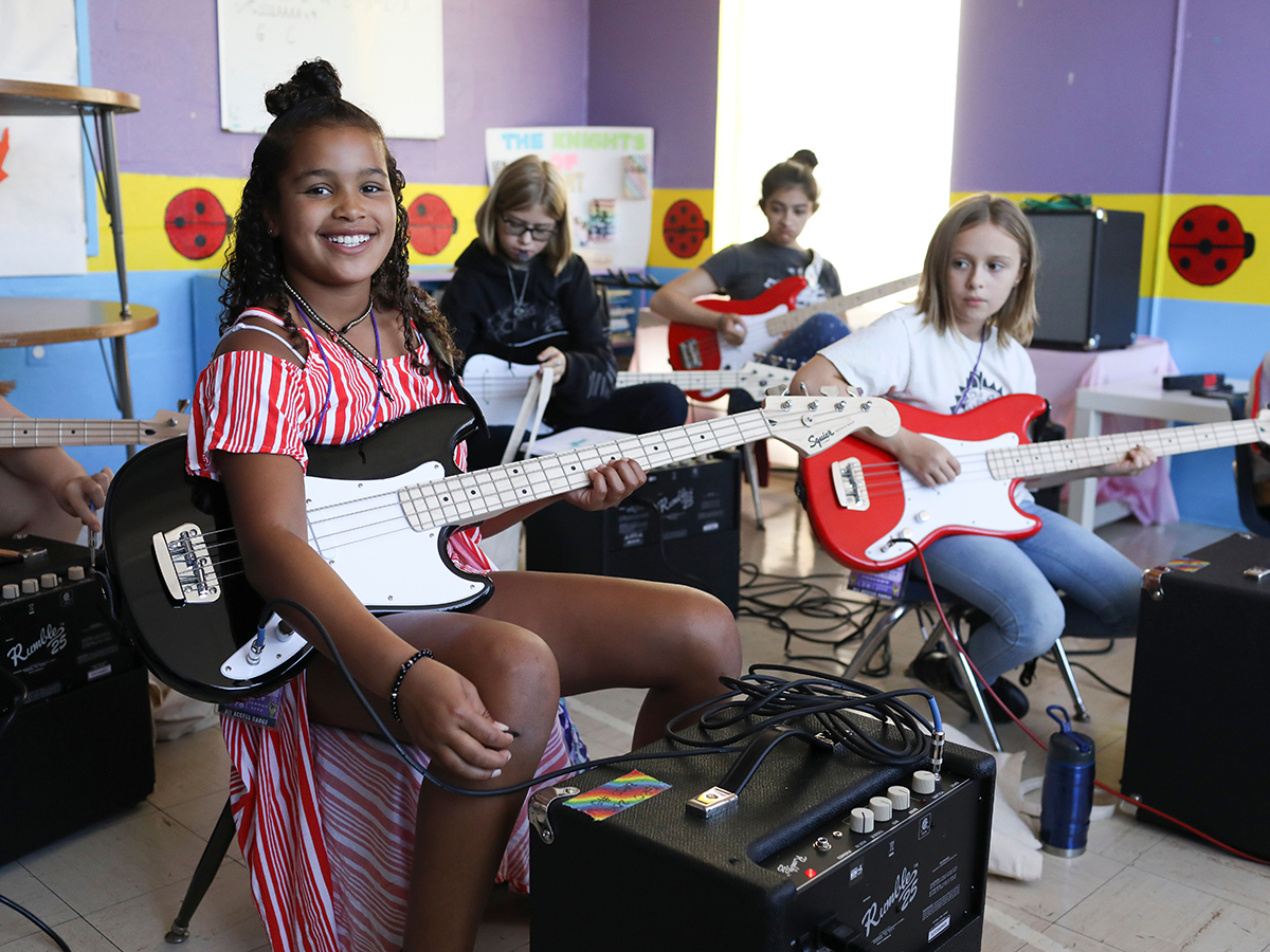 Girls playing rock guitars