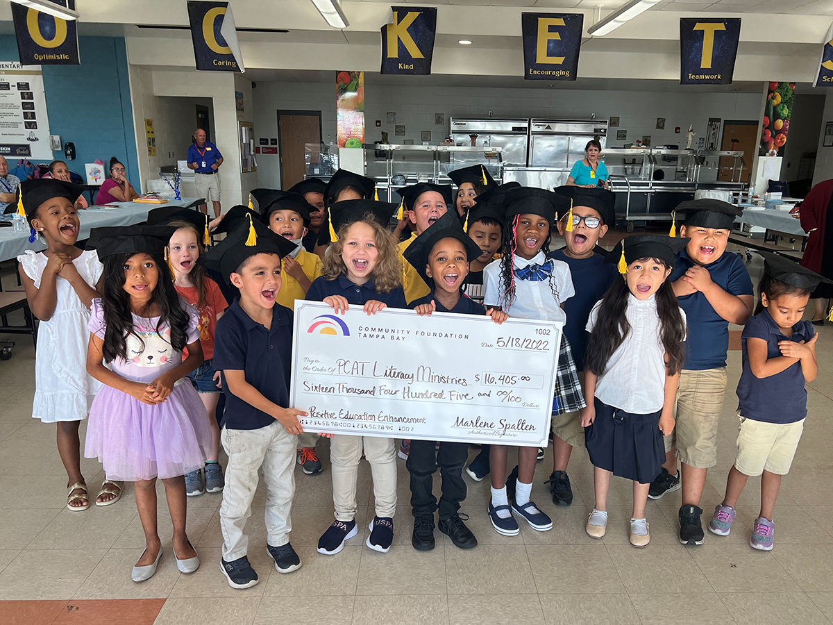 kids holding PCAT check