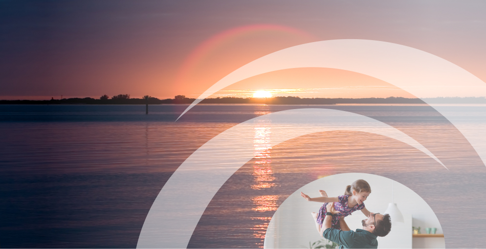 Sunset image with a smaller image of a dad lifting his daughter up above his head